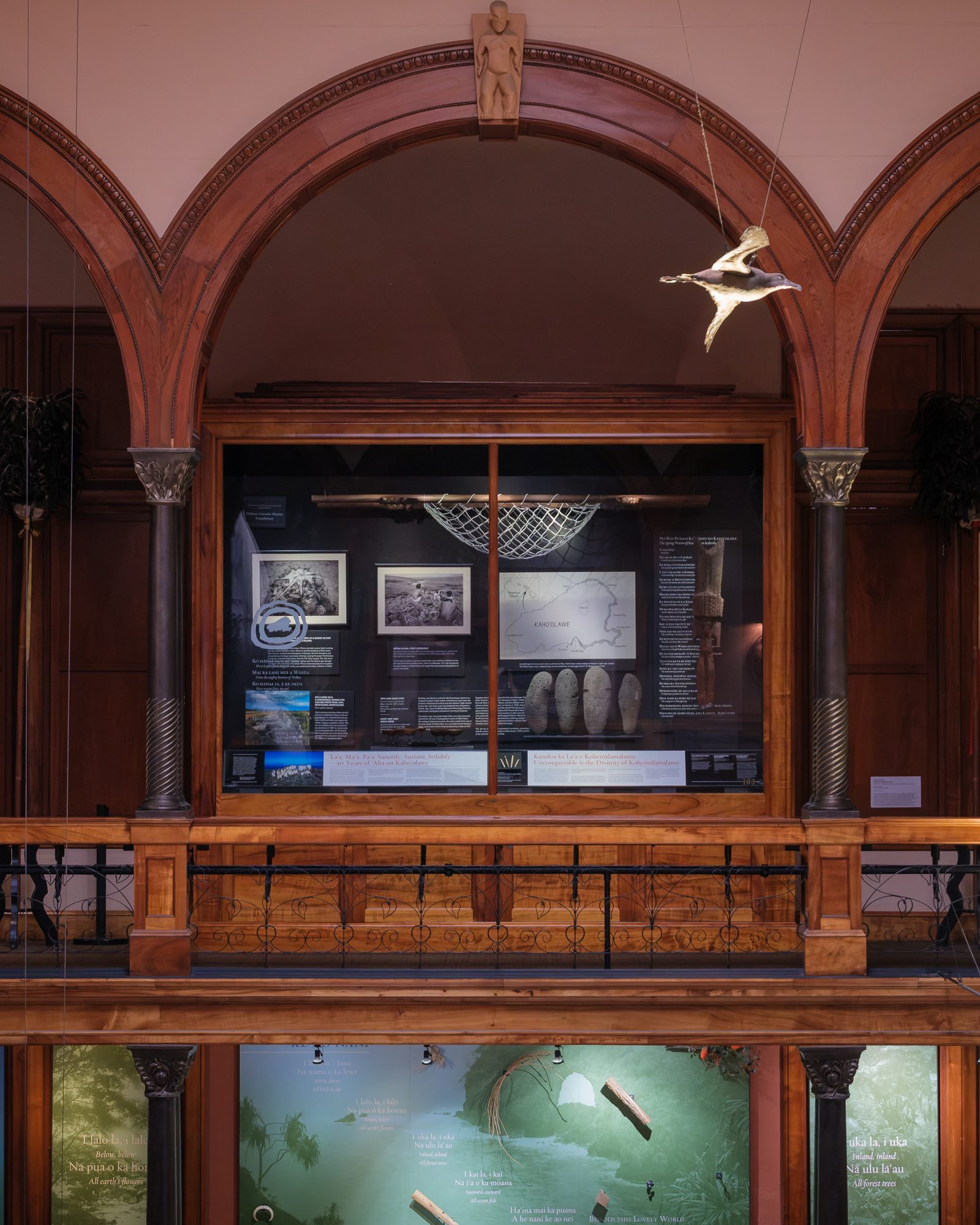 The Treasure Case beneath a koa arch on the third floor of Hawaiian Hall.